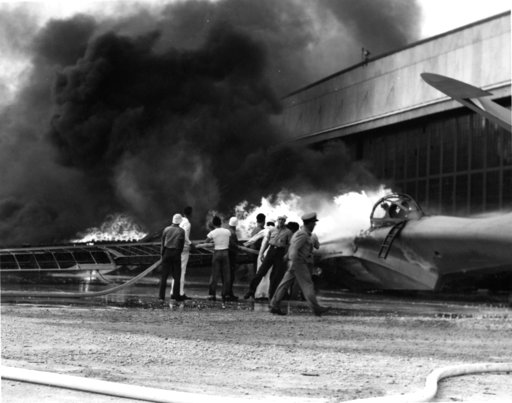 (U.S. Navy via AP, File). FILE - In this Dec. 7, 1941 file photo provided by the U.S. Navy, a patrol bomber burns at a military installation on Oahu's Kaneohe Bay during the Japanese attack on Pearl Harbor in Hawaii. Retired U.S. Navy Cmdr. Don Long wa... (U.S. Navy via AP, File). FILE - In this Dec. 7, 1941 file photo provided by the U.S. Navy, a patrol bomber burns at a military installation on Oahu's Kaneohe Bay during the Japanese attack on Pearl Harbor in Hawaii. Retired U.S. Navy Cmdr. Don Long wa...