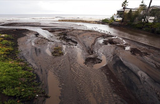 (AP Photo/Reed Saxon). Mud and debris fill the outfall where Trancas Creek flows into the Pacific Ocean in an area burned by the Woolsey fire in Malibu, Calif. Thursday, Dec. 6, 2018. The second round of a fall storm is causing flooding on Los Angeles-... (AP Photo/Reed Saxon). Mud and debris fill the outfall where Trancas Creek flows into the Pacific Ocean in an area burned by the Woolsey fire in Malibu, Calif. Thursday, Dec. 6, 2018. The second round of a fall storm is causing flooding on Los Angeles-...