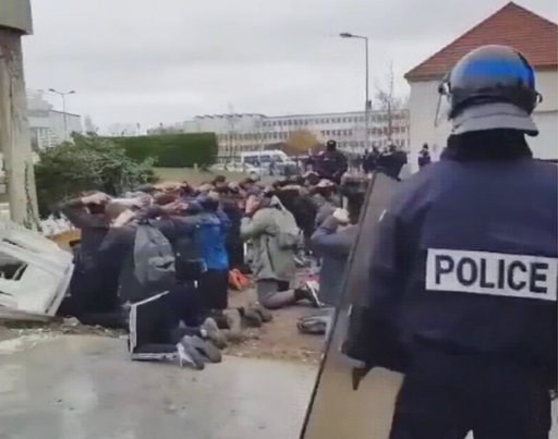 (UGC video via AP). In this image taken from amateur video, showing police as they detain a large number of students Thursday Dec. 6, 2018, at Mantes-la-Jolie, France. Images have been shared widely on social media, showing a mass of students being de... (UGC video via AP). In this image taken from amateur video, showing police as they detain a large number of students Thursday Dec. 6, 2018, at Mantes-la-Jolie, France. Images have been shared widely on social media, showing a mass of students being de...