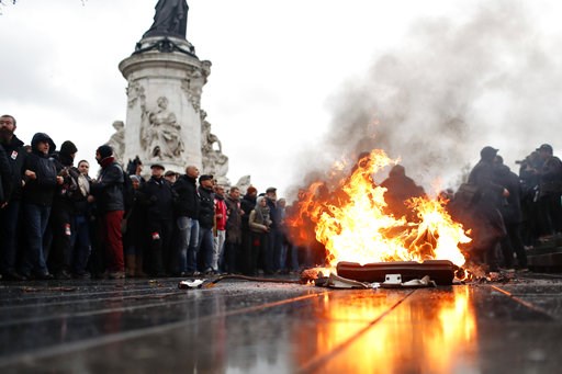 (AP Photo/Thibault Camus). A bin is burning as school children demonstrate in Paris, Friday Dec.7, 2018. Footage showing the brutal arrest of high school students protesting outside Paris is causing a stir ahead of further anti-government protests this... (AP Photo/Thibault Camus). A bin is burning as school children demonstrate in Paris, Friday Dec.7, 2018. Footage showing the brutal arrest of high school students protesting outside Paris is causing a stir ahead of further anti-government protests this...