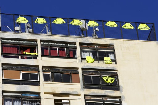 (AP Photo/Claude Paris). Yellow vests hang on the rooftop of an apartment building Friday, Dec. 7, 2018 in Marseille, southern France. Across the country, France is mobilizing some 89,000 police, up from 65,000 last weekend when more than 130 people we... (AP Photo/Claude Paris). Yellow vests hang on the rooftop of an apartment building Friday, Dec. 7, 2018 in Marseille, southern France. Across the country, France is mobilizing some 89,000 police, up from 65,000 last weekend when more than 130 people we...
