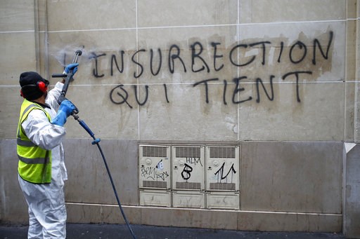 (AP Photo/Francois Mori). A worker cleans a graffiti reading "long term unrest" near the Champs-Elysees avenue, Friday, Dec. 7, 2018 in Paris. France was mobilizing tens of thousands of police officers and closing landmarks including the Eiffel Tower a... (AP Photo/Francois Mori). A worker cleans a graffiti reading "long term unrest" near the Champs-Elysees avenue, Friday, Dec. 7, 2018 in Paris. France was mobilizing tens of thousands of police officers and closing landmarks including the Eiffel Tower a...