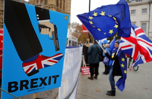 (AP Photo/Frank Augstein). Protestors demonstrate opposite Parliament against Britain's Brexit split from Europe, in London, Thursday, Dec. 6, 2018. Britain's Prime Minister Theresa May's effort to win support for her Brexit agreement comes amid repor... (AP Photo/Frank Augstein). Protestors demonstrate opposite Parliament against Britain's Brexit split from Europe, in London, Thursday, Dec. 6, 2018. Britain's Prime Minister Theresa May's effort to win support for her Brexit agreement comes amid repor...