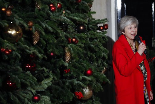 (AP Photo/Frank Augstein). Britain's Prime Minister Theresa May attends the ceremony to light up a Christmas tree at 10 Downing Street in London, Thursday, Dec. 6, 2018. (AP Photo/Frank Augstein). Britain's Prime Minister Theresa May attends the ceremony to light up a Christmas tree at 10 Downing Street in London, Thursday, Dec. 6, 2018.