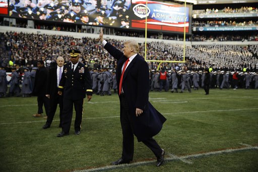 (AP Photo/Matt Rourke). President Donald Trump waves to attendees ahead of an NCAA college football between Army and Navy, Saturday, Dec. 8, 2018, in Philadelphia. (AP Photo/Matt Rourke). President Donald Trump waves to attendees ahead of an NCAA college football between Army and Navy, Saturday, Dec. 8, 2018, in Philadelphia.