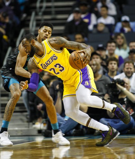 James, Ball post triple-doubles in 128-100 win over Hornets