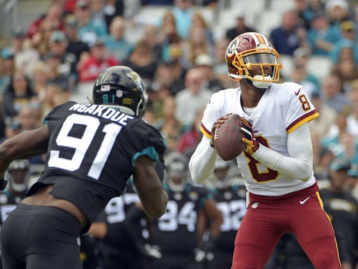 Johnson leads Redskins to late scores, 16-13 win at Jaguars