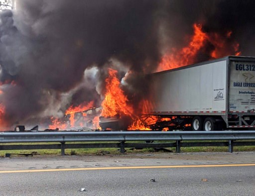 (WGFL-Gainesville via AP). Flames engulf vehicles after a fiery crash along Interstate 75, Thursday, Jan. 3, 2019, about a mile south of Alachua, near Gainesville, Fla. Highway officials say at least six people have died after a crash and diesel fuel s... (WGFL-Gainesville via AP). Flames engulf vehicles after a fiery crash along Interstate 75, Thursday, Jan. 3, 2019, about a mile south of Alachua, near Gainesville, Fla. Highway officials say at least six people have died after a crash and diesel fuel s...