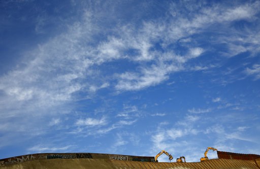 (AP Photo/Gregory Bull). Workers replace sections of the border wall, left, with new sections, right, Tuesday, Jan. 8, 2019, in Tijuana, Mexico. Ready to make his case on prime-time TV, President Donald Trump is stressing humanitarian as well as securi... (AP Photo/Gregory Bull). Workers replace sections of the border wall, left, with new sections, right, Tuesday, Jan. 8, 2019, in Tijuana, Mexico. Ready to make his case on prime-time TV, President Donald Trump is stressing humanitarian as well as securi...