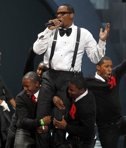 (AP Photo/David Goldman, file). FILE - In this Nov. 10, 2010 file photo, singer R. Kelly performs "When A Woman Loves," during the Soul Train awards in Atlanta. Kelly, one of the top-selling recording artists of all time, has been hounded for years by ... (AP Photo/David Goldman, file). FILE - In this Nov. 10, 2010 file photo, singer R. Kelly performs "When A Woman Loves," during the Soul Train awards in Atlanta. Kelly, one of the top-selling recording artists of all time, has been hounded for years by ...