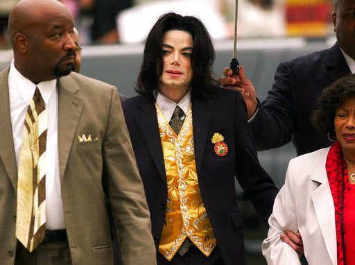 (Aaron Lambert/Santa Maria Times via AP, Pool). FILE - In this May 25, 2005 file photo, Michael Jackson arrives at the Santa Barbara County Courthouse for his child molestation trial in Santa Maria, Calif. A documentary film about two boys who accused ... (Aaron Lambert/Santa Maria Times via AP, Pool). FILE - In this May 25, 2005 file photo, Michael Jackson arrives at the Santa Barbara County Courthouse for his child molestation trial in Santa Maria, Calif. A documentary film about two boys who accused ...