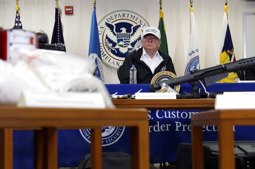 (AP Photo/ Evan Vucci). With illegal drugs and weapons displayed in the foreground, President Donald Trump speaks at a roundtable on immigration and border security at U.S. Border Patrol McAllen Station, during a visit to the southern border, Thursday,... (AP Photo/ Evan Vucci). With illegal drugs and weapons displayed in the foreground, President Donald Trump speaks at a roundtable on immigration and border security at U.S. Border Patrol McAllen Station, during a visit to the southern border, Thursday,...