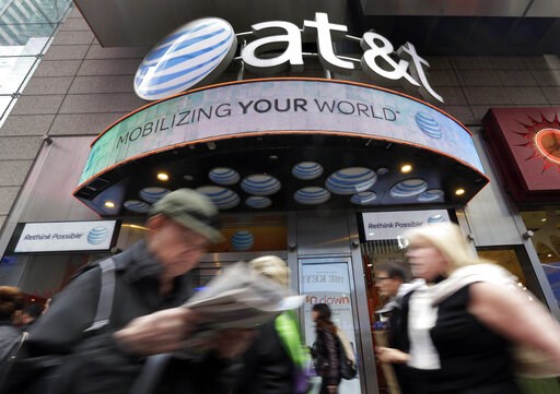 (AP Photo/Richard Drew, file). In this Oct. 21, 2014 file photo, people pass an AT&T store in New York's Times Square. AT&T says it will stop selling customer location data to data brokers, as the telecom industry faces backlash that the data h...