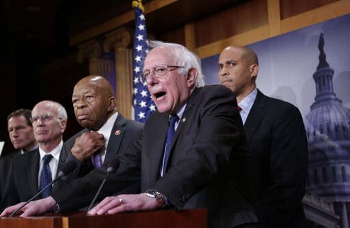 (AP Photo/J. Scott Applewhite). Sen. Bernie Sanders, I-Vt., center, joined from left by Sen. Richard Blumenthal, D-Conn., Rep. Peter Welch, D-Vt., Rep. Elijah Cummings, D-Md., and Sen. Cory Booker, D-N.J., speaks to reporters as he prepares to introduc... (AP Photo/J. Scott Applewhite). Sen. Bernie Sanders, I-Vt., center, joined from left by Sen. Richard Blumenthal, D-Conn., Rep. Peter Welch, D-Vt., Rep. Elijah Cummings, D-Md., and Sen. Cory Booker, D-N.J., speaks to reporters as he prepares to introduc...