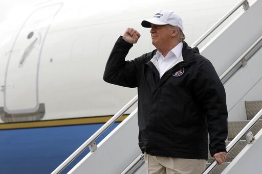 (AP Photo/ Evan Vucci). President Donald Trump gestures after arriving at McAllen International Airport for a visit to the southern border, Thursday, Jan. 10, 2019, in McAllen, Texas. (AP Photo/ Evan Vucci). President Donald Trump gestures after arriving at McAllen International Airport for a visit to the southern border, Thursday, Jan. 10, 2019, in McAllen, Texas.