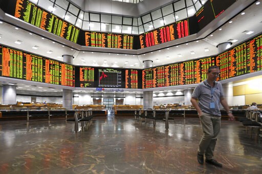 (AP Photo/Vincent Thian). Visitor walk under a stock trading board at a private stock market gallery in Kuala Lumpur, Malaysia, Friday, Jan. 11, 2019. Asian markets were mostly higher on Friday as investors cheered a more reactive Federal Reserve and U... (AP Photo/Vincent Thian). Visitor walk under a stock trading board at a private stock market gallery in Kuala Lumpur, Malaysia, Friday, Jan. 11, 2019. Asian markets were mostly higher on Friday as investors cheered a more reactive Federal Reserve and U...