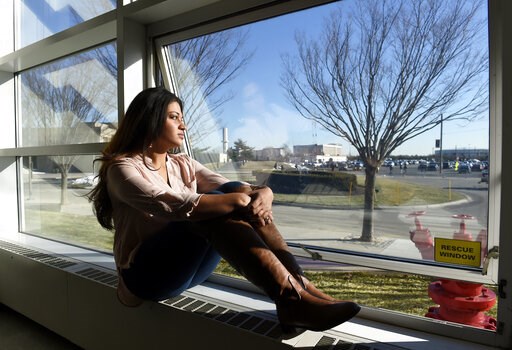 (AP Photo/Kathy Kmonicek). FILE - In this Feb. 2, 2016, file photo, Naila Amin, 26, looks out from a classroom window at Nassau Community College in Garden City, N.Y. According to data provided to The Associated Press, the U.S. approved thousands of re... (AP Photo/Kathy Kmonicek). FILE - In this Feb. 2, 2016, file photo, Naila Amin, 26, looks out from a classroom window at Nassau Community College in Garden City, N.Y. According to data provided to The Associated Press, the U.S. approved thousands of re...