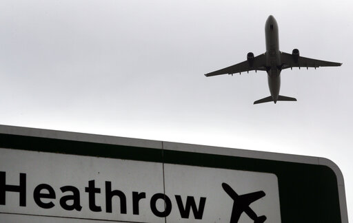 (AP Photo/Kirsty Wigglesworth, file). FILE - In this file photo dated Tuesday, June 5, 2018, a plane takes off over a road sign near Heathrow Airport in London. British lawmakers are set to vote Monday June 25, 2018, on whether to expand Europe's bigge... (AP Photo/Kirsty Wigglesworth, file). FILE - In this file photo dated Tuesday, June 5, 2018, a plane takes off over a road sign near Heathrow Airport in London. British lawmakers are set to vote Monday June 25, 2018, on whether to expand Europe's bigge...