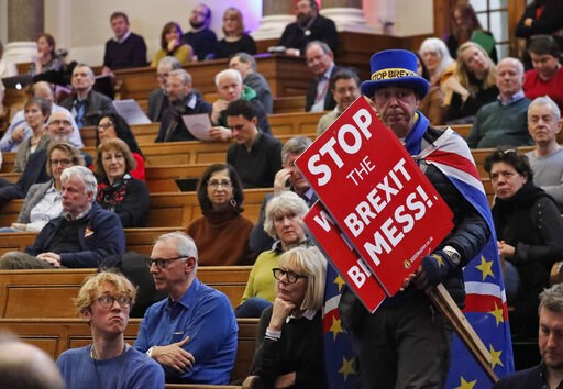 (AP Photo/Frank Augstein). A demonstrator enters the emergency, public gathering 'Think Anew, Act Anew: a Convention on Brexit and a People's Vote', in London, Friday, Jan. 11, 2019, ahead of the big parliamentary debate on the UK and the EU. (AP Photo/Frank Augstein). A demonstrator enters the emergency, public gathering 'Think Anew, Act Anew: a Convention on Brexit and a People's Vote', in London, Friday, Jan. 11, 2019, ahead of the big parliamentary debate on the UK and the EU.