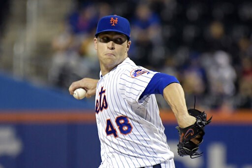 (AP Photo/Bill Kostroun, File). FILE - In this Sept. 26, 2018, file photo, New York Mets pitcher Jacob deGrom delivers the ball to the Atlanta Braves during the second inning of a baseball game in New York. NL Cy Young Award winner Jacob deGrom and the...