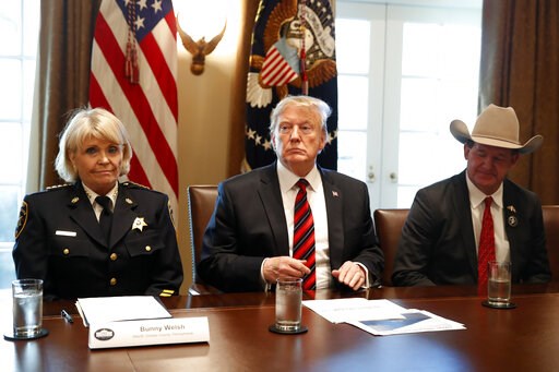 (AP Photo/Jacquelyn Martin). President Donald Trump, with Carolyn "Bunny" Welsh, sheriff of Chester County, Pa., left, and AJ Louderback, sheriff of Jackson County, Texas, attends a roundtable discussion on border security with local leaders, Friday Ja... (AP Photo/Jacquelyn Martin). President Donald Trump, with Carolyn "Bunny" Welsh, sheriff of Chester County, Pa., left, and AJ Louderback, sheriff of Jackson County, Texas, attends a roundtable discussion on border security with local leaders, Friday Ja...