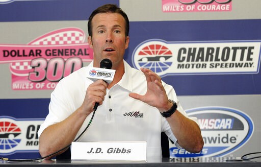 (AP Photo/Mike McCarn). FILE - In this Oct. 14, 2011 file photo, J.D. Gibbs, president of Joe Gibbs Racing, speaks during a news conference before the NASCAR Nationwide auto race at Charlotte Motor Speedway in Concord, N.C. Joe Gibbs Racing says co-f...