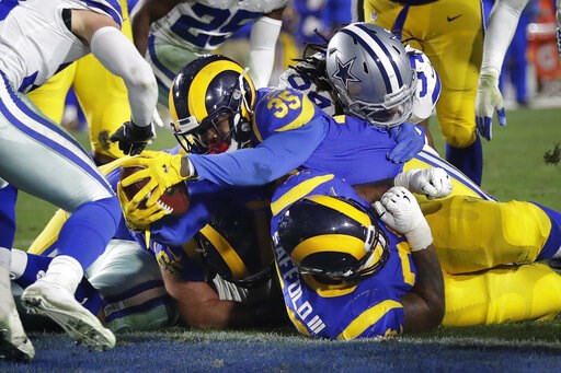 (AP Photo/Marcio Jose Sanchez). Los Angeles Rams running back C.J. Anderson scores against the Dallas Cowboys during the first half in an NFL divisional football playoff game Saturday, Jan. 12, 2019, in Los Angeles. (AP Photo/Marcio Jose Sanchez). Los Angeles Rams running back C.J. Anderson scores against the Dallas Cowboys during the first half in an NFL divisional football playoff game Saturday, Jan. 12, 2019, in Los Angeles.