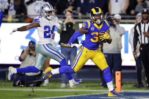 (AP Photo/Jae C. Hong). Los Angeles Rams running back Todd Gurley scores past Dallas Cowboys cornerback Chidobe Awuzie during the first half in an NFL divisional football playoff game Saturday, Jan. 12, 2019, in Los Angeles. (AP Photo/Jae C. Hong). Los Angeles Rams running back Todd Gurley scores past Dallas Cowboys cornerback Chidobe Awuzie during the first half in an NFL divisional football playoff game Saturday, Jan. 12, 2019, in Los Angeles.