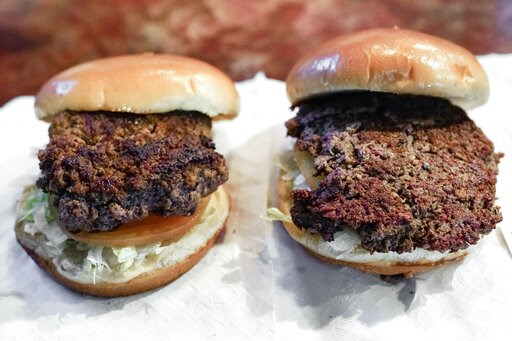 (AP Photo/Nati Harnik). A conventional beef burger, left, is seen Friday, Jan. 11, 2019, next to "The Impossible Burger", right, a plant-based burger containing wheat protein, coconut oil and potato protein among it's ingredients. The ingredients of th... (AP Photo/Nati Harnik). A conventional beef burger, left, is seen Friday, Jan. 11, 2019, next to "The Impossible Burger", right, a plant-based burger containing wheat protein, coconut oil and potato protein among it's ingredients. The ingredients of th...