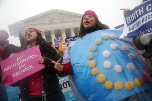 (AP Photo/Charles Dharapak, File). FILE - In this March 25, 2015 file photo, Margot Riphagen of New Orleans, La., wears a birth control pills costume during a protest in front of the U.S. Supreme Court in Washington. A U.S. judge will hear arguments Fr... (AP Photo/Charles Dharapak, File). FILE - In this March 25, 2015 file photo, Margot Riphagen of New Orleans, La., wears a birth control pills costume during a protest in front of the U.S. Supreme Court in Washington. A U.S. judge will hear arguments Fr...