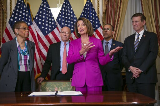 (AP Photo/J. Scott Applewhite). Speaker of the House Nancy Pelosi, D-Calif., talks to reporters after signing a House-passed a bill requiring that all government workers receive retroactive pay after the partial shutdown ends, at the Capitol in Washing... (AP Photo/J. Scott Applewhite). Speaker of the House Nancy Pelosi, D-Calif., talks to reporters after signing a House-passed a bill requiring that all government workers receive retroactive pay after the partial shutdown ends, at the Capitol in Washing...