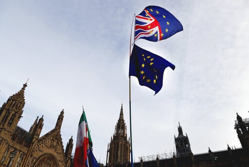 (AP Photo/Frank Augstein). A Pro-European demonstrator raises flags to protest outside parliament in London, Friday, Jan. 11, 2019. Britain's Prime Minister Theresa May is struggling to win support for her Brexit deal in Parliament. Lawmakers are due t... (AP Photo/Frank Augstein). A Pro-European demonstrator raises flags to protest outside parliament in London, Friday, Jan. 11, 2019. Britain's Prime Minister Theresa May is struggling to win support for her Brexit deal in Parliament. Lawmakers are due t...