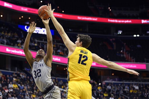 No. 15 Marquette survives Georgetown despite Howard's injury
