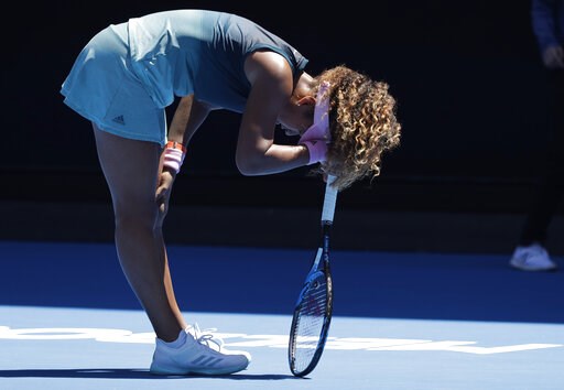 Racket-smashing, tumbling Osaka advances at Australian Open