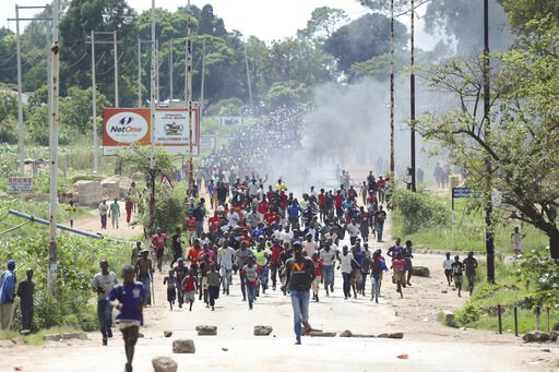 Zimbabwe's president returns amid economic crisis, crackdown