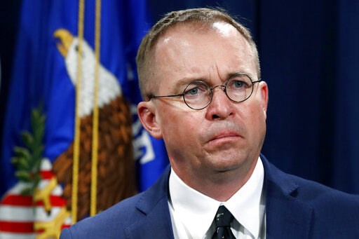 (AP Photo/Jacquelyn Martin, File). FILE- In this July 11, 2018, file photo Mick Mulvaney, acting director of the Consumer Financial Protection Bureau (CFPB), and Director of the Office of Management, listens during a news conference at the Department o... (AP Photo/Jacquelyn Martin, File). FILE- In this July 11, 2018, file photo Mick Mulvaney, acting director of the Consumer Financial Protection Bureau (CFPB), and Director of the Office of Management, listens during a news conference at the Department o...