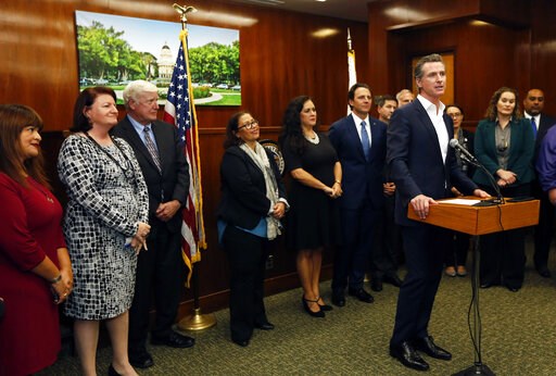 (K.C. Alfred/The San Diego Union-Tribune via AP, File). FILE - In this Jan. 31, 2019, file photo, California Gov. Gavin Newsom speaks after meeting with city leaders about an effort to provide relief and humanitarian aid to asylum seekers in San Diego.... (K.C. Alfred/The San Diego Union-Tribune via AP, File). FILE - In this Jan. 31, 2019, file photo, California Gov. Gavin Newsom speaks after meeting with city leaders about an effort to provide relief and humanitarian aid to asylum seekers in San Diego....