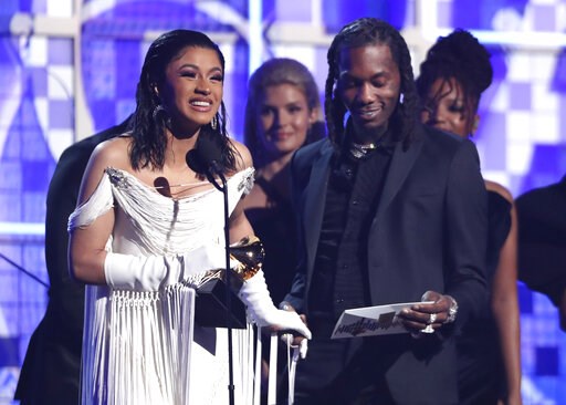 (Photo by Matt Sayles/Invision/AP). Cardi B, left, accepts the award for best rap album for "Invasion of Privacy" as Offset looks on at the 61st annual Grammy Awards on Sunday, Feb. 10, 2019, in Los Angeles. (Photo by Matt Sayles/Invision/AP). Cardi B, left, accepts the award for best rap album for "Invasion of Privacy" as Offset looks on at the 61st annual Grammy Awards on Sunday, Feb. 10, 2019, in Los Angeles.