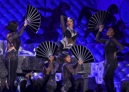 (Photo by Matt Sayles/Invision/AP). Cardi B performs "Money" at the 61st annual Grammy Awards on Sunday, Feb. 10, 2019, in Los Angeles. (Photo by Matt Sayles/Invision/AP). Cardi B performs "Money" at the 61st annual Grammy Awards on Sunday, Feb. 10, 2019, in Los Angeles.