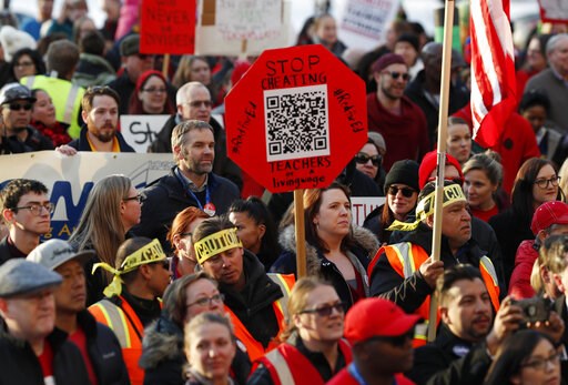 (AP Photo/David Zalubowski, File). FILE - In this Jan. 30, 2019, file photo, Denver Public Schools teachers rally outside the State Capitol in Denver. Denver teachers are planning to strike Monday, Feb. 11, 2019 after failed negotiations with the schoo... (AP Photo/David Zalubowski, File). FILE - In this Jan. 30, 2019, file photo, Denver Public Schools teachers rally outside the State Capitol in Denver. Denver teachers are planning to strike Monday, Feb. 11, 2019 after failed negotiations with the schoo...