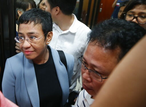 (AP Photo/Bullit Marquez). Maria Ressa, the award-winning head of a Philippine online news site Rappler that has aggressively covered President Rodrigo Duterte's policies, is escorted into another room following her arrest by National Bureau of Investi... (AP Photo/Bullit Marquez). Maria Ressa, the award-winning head of a Philippine online news site Rappler that has aggressively covered President Rodrigo Duterte's policies, is escorted into another room following her arrest by National Bureau of Investi...