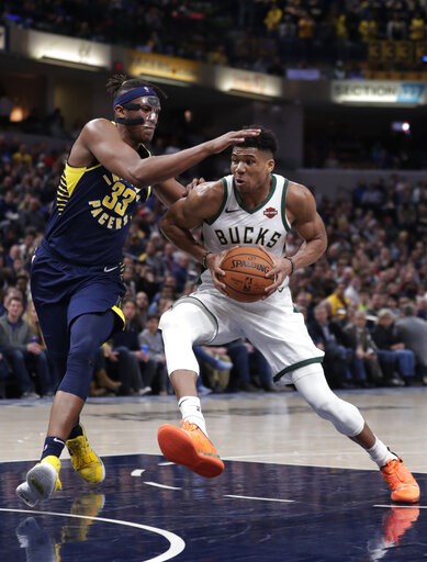 The Latest: OKC's Diallo leaps over Shaq to win dunk contest