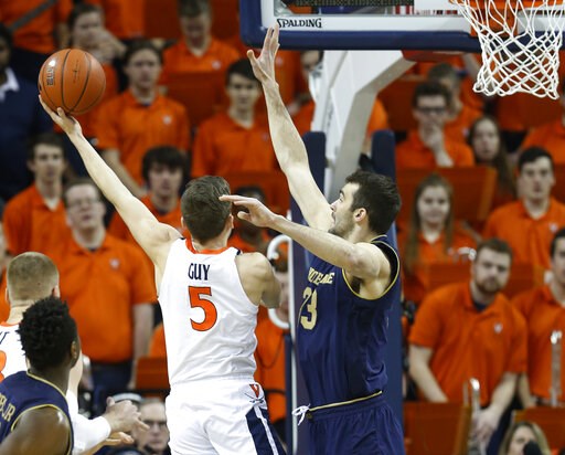 Guy, Hunter lead No. 4 Virginia past Irish, 60-54