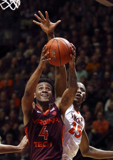 Guy's 23 lift No. 3 Virginia past No. 20 Hokies, 64-58