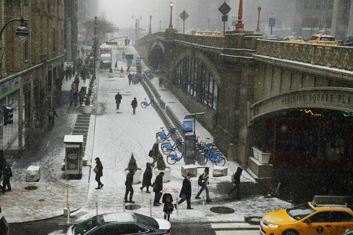 Winter storm closes schools, snarls travel across much of US