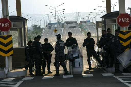 Maduro's opponents brave tear gas in push to deliver aid