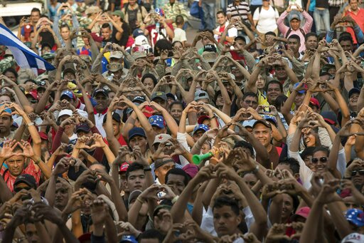 The Latest: Venezuelans demand aid at Brazil border