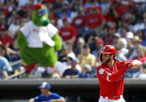 Harper walks twice in Phils debut, draws 4-man outfield