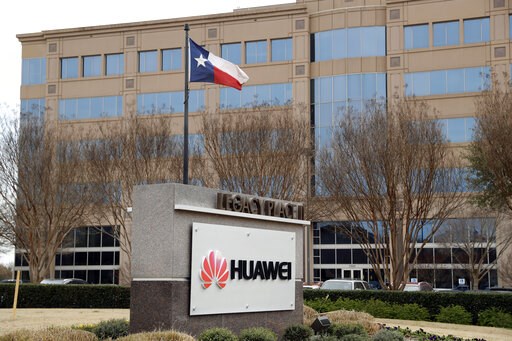 (AP Photo/Tony Gutierrez, File). FILE - This March 7, 2019 file photo shows the Huawei Technologies Ltd. business location in Plano, Texas. The No. 2 smartphone maker in the world will be arraigned at federal court in New York on Thursday, March 14. Pr...