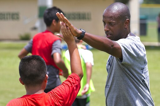 (Doug Engle/Star-Banner via AP). In a September 2016 photo, Yale's women's Head Soccer Coach Rudy Meredith gives a high five to a player after making a great play in a scrimmage, in Frankfort, Ky. According to the federal indictments unsealed Tuesday, ... (Doug Engle/Star-Banner via AP). In a September 2016 photo, Yale's women's Head Soccer Coach Rudy Meredith gives a high five to a player after making a great play in a scrimmage, in Frankfort, Ky. According to the federal indictments unsealed Tuesday, ...